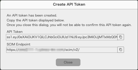 Captura de pantalla: El token de API creado y el punto final SCIM se muestran en el cuadro de diálogo "Crear token de API".